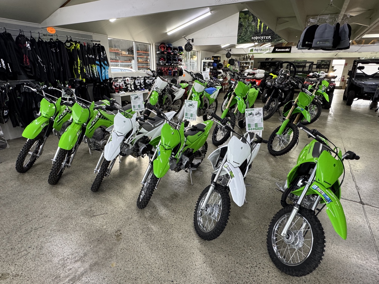 Green Kawasaki dirt bikes in the Motoworx showroom