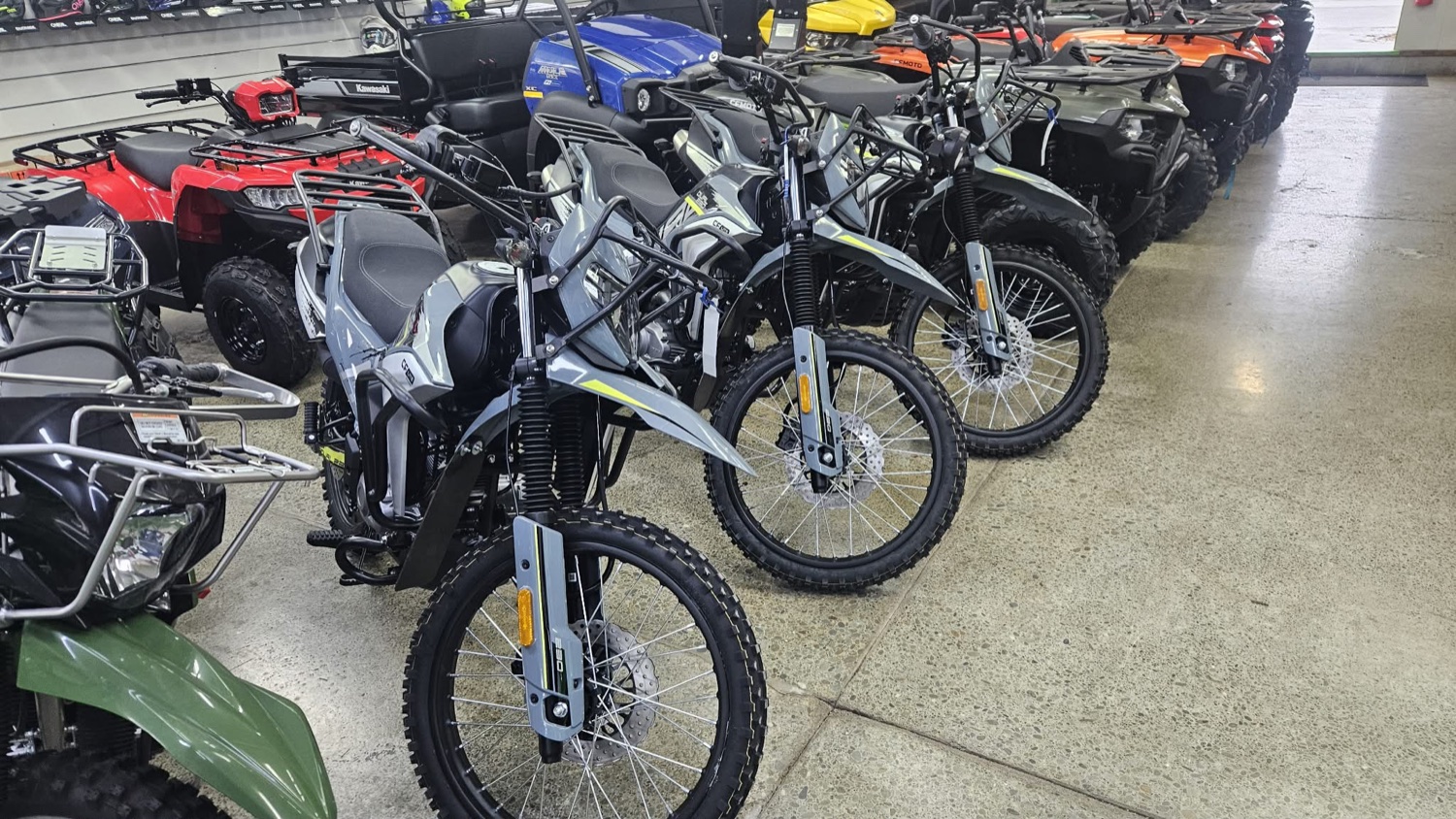 Motorcycles and quads on the showroom floor